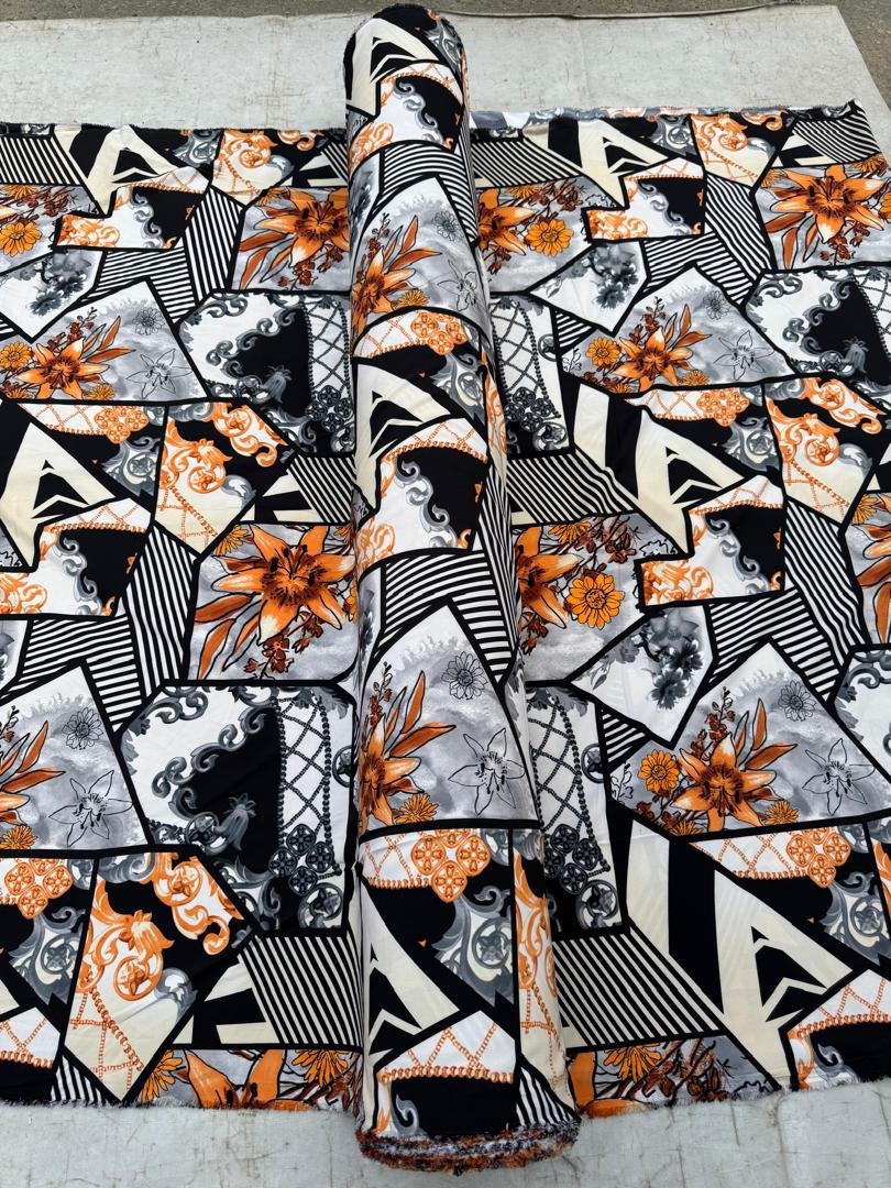 Luxury Ankara Fabric – Black, White & Orange Geometric Floral Print (Original Quality)